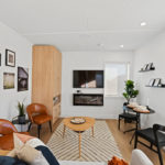 Brauer Living Pods - Living/Dining Room TV and Fireplace